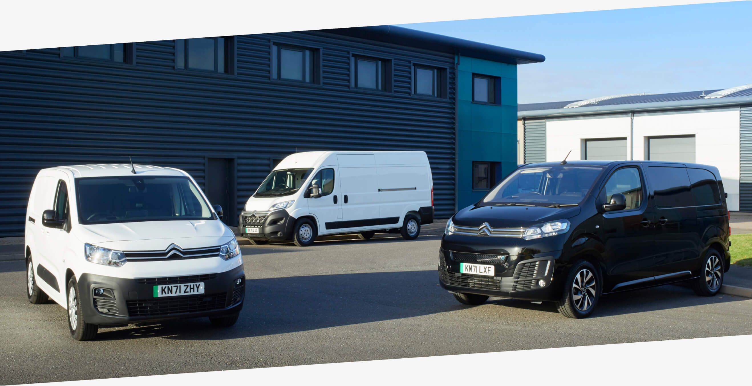 Product geniuses standing outside an Arnold Clark Click & Collect location