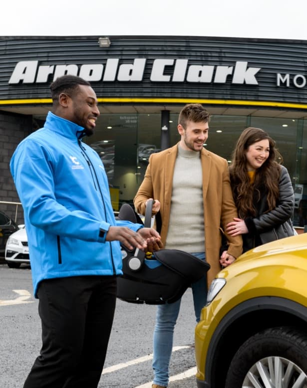 Product Consultant showing customers' their car